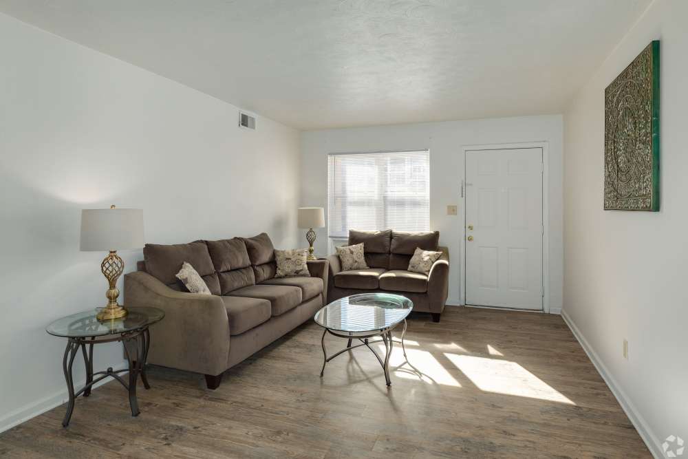 Living room with front door and hardwood floor at Admiral's Way in Norfolk, Virginia