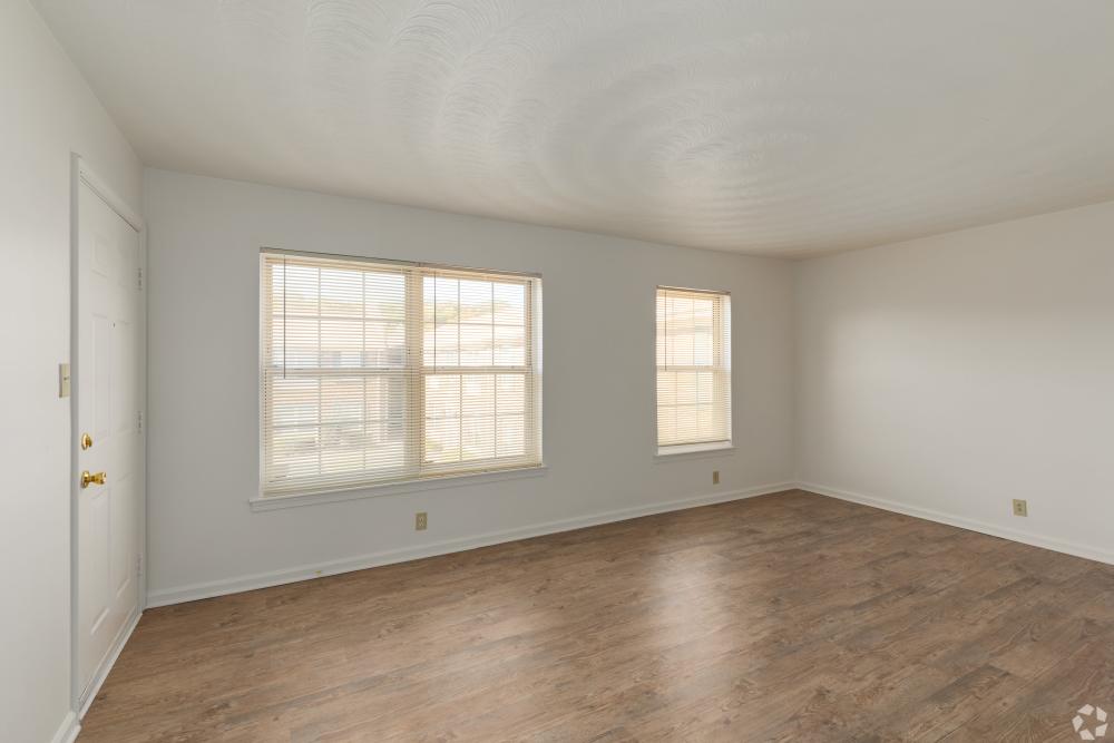 Empty bedroom with white walls and a window at Admiral's Way in Norfolk, Virginia