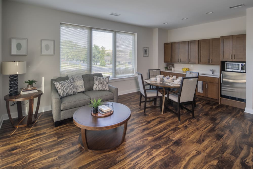 Dining area of senior apartment with hardwood floors at Eagleview Landing in Exton, Pennsylvania