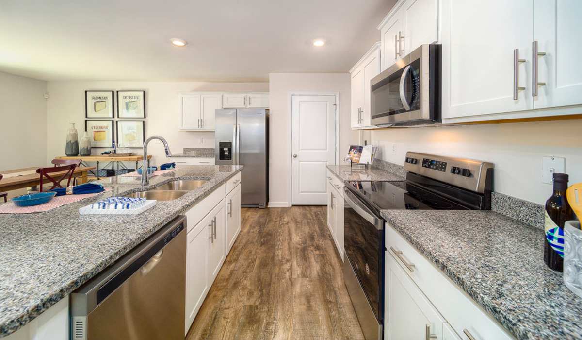 Kitchen with refrigerator at Norwood Walk in Troutman, North Carolina