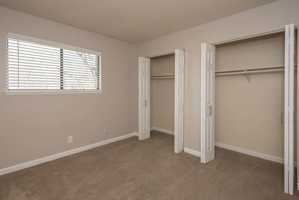Bedroom with closets at California Center Apartments in Sacramento, California