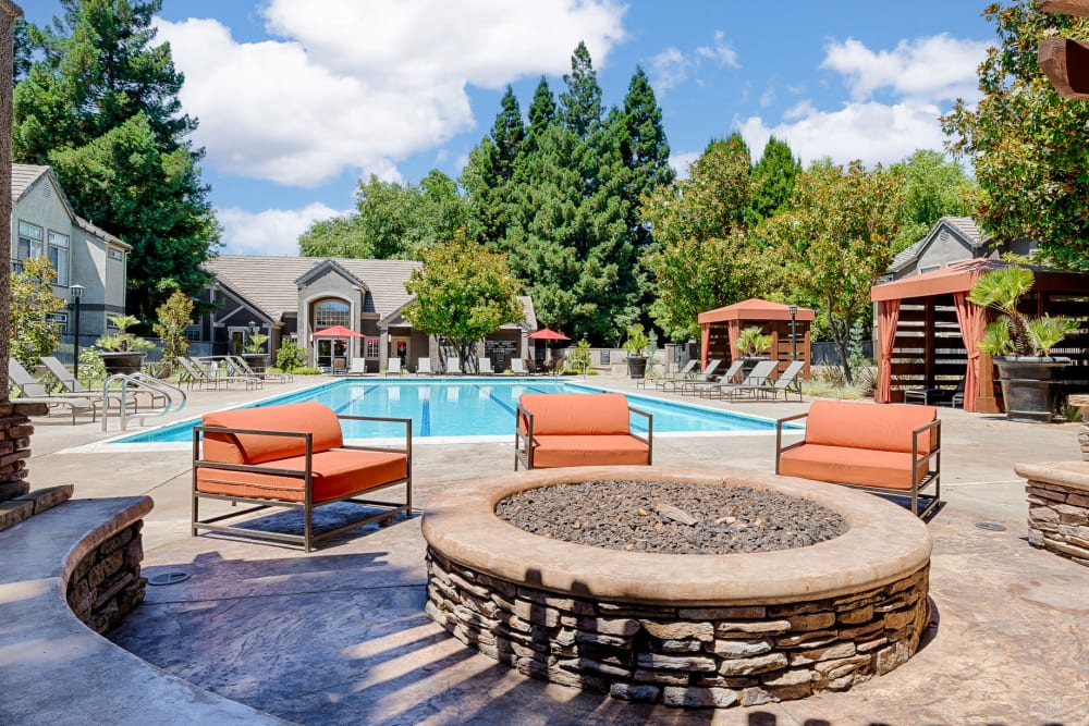 A clubhouse patio next to a large firepit at Larkspur Woods in Sacramento, California