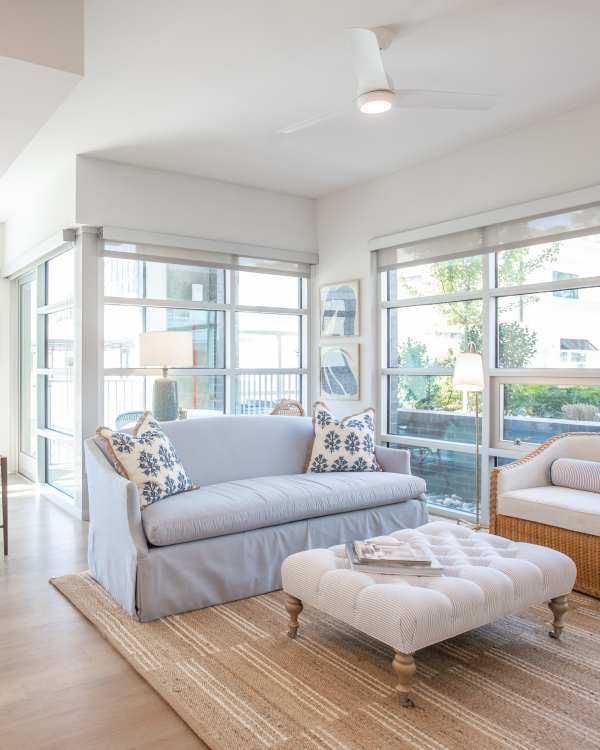 Living room with huge glass windows at Highland North Hills in Raleigh, North Carolina