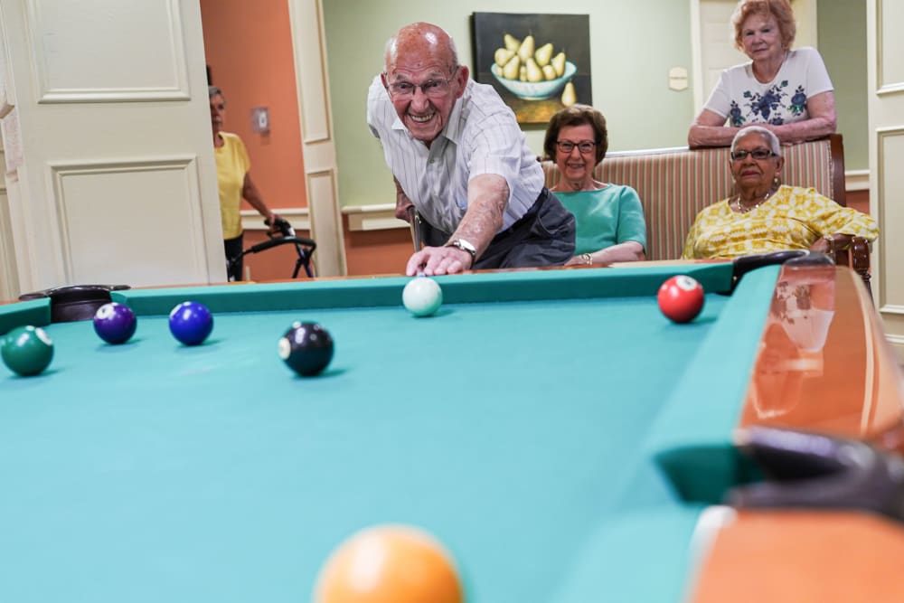 Residents playing pool at The Harmony Collection at Roanoke - Assisted Living in Roanoke, Virginia