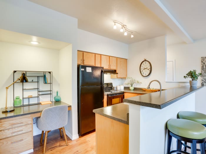 Modern kitchen and adjacent study nook in model home at Big Trout Lodge in Liberty Lake, WA