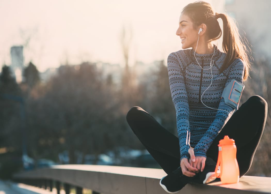 Woman taking a break from a run near The Pointe of Ridgeland in Ridgeland, Mississippi