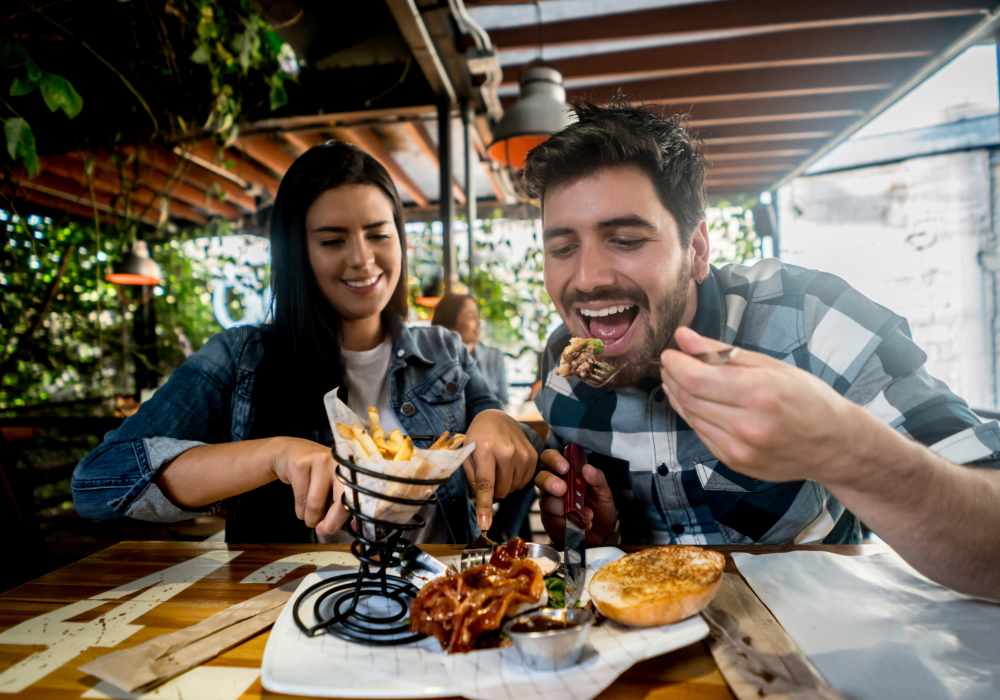 A couple having a meal in a restaurant near The Southerly at Orange City in Orange City, Florida