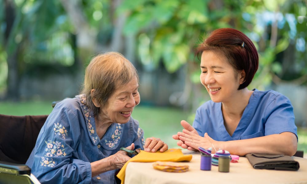 Stimulating activities with caregivers at Beach Terrace in Stanton, California
