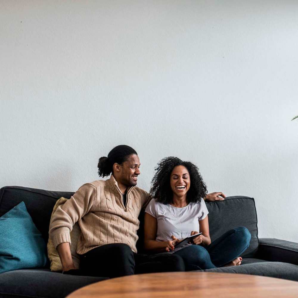 A happy resident couple in their apartment home at Pecan Bend in Mansfield, Texas