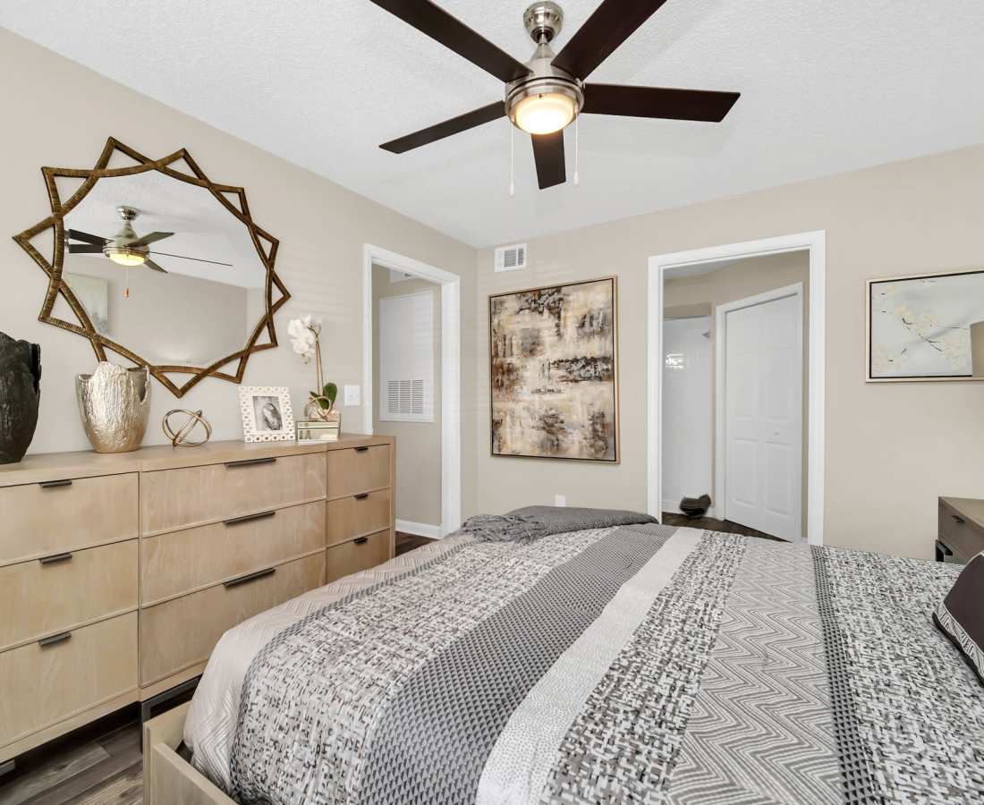 Bedroom with storage vanity at The Summit At Metrowest in Orlando, Florida