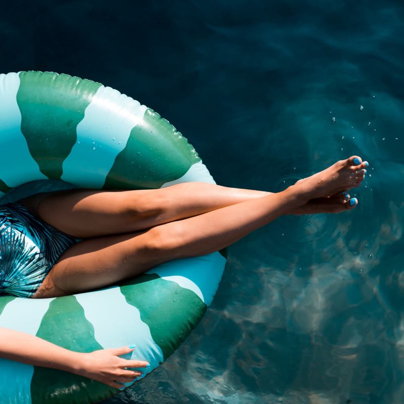 A resident floats on a floatie in the pool at Elevations One, Woodbridge, Virginia