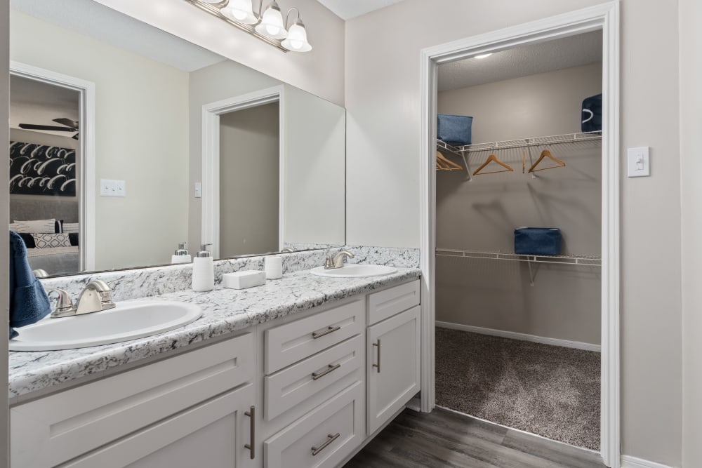 An apartment bathroom with a full tub at Lenox Gates in Mobile, Alabama