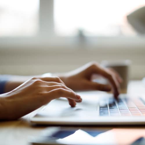 Resident Using Laptop at Boulder Crescent in Colorado Springs, Colorado