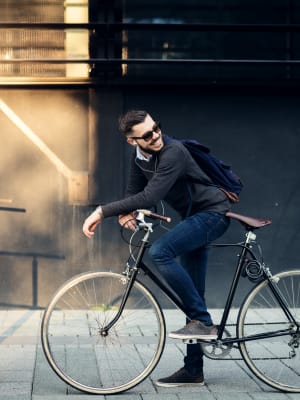 A guy bikes to work in Denver, Colorado