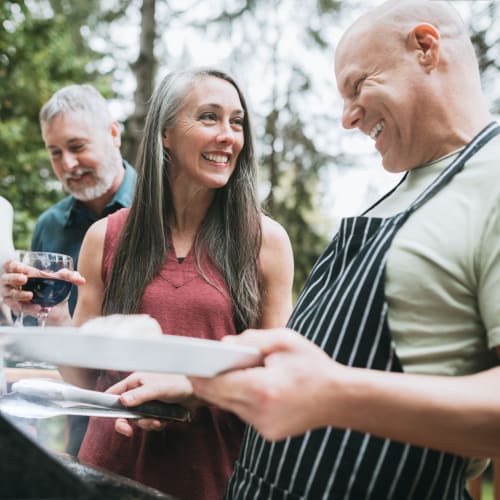 Residents enjoying a barbeque together at Bayview Hills in San Diego, California