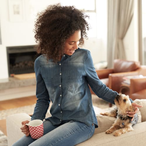 A resident playing with her dog at Hamilton Redoubt in Newport News, Virginia