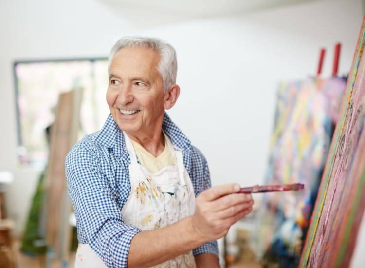 Resident working on a painting at Mendenwood in Memphis, Tennessee