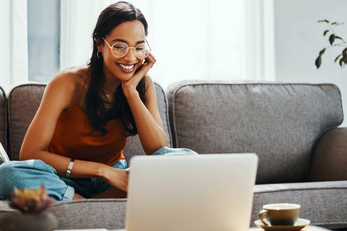 Resident working on laptop at Autumn Pines in Humble, Texas
