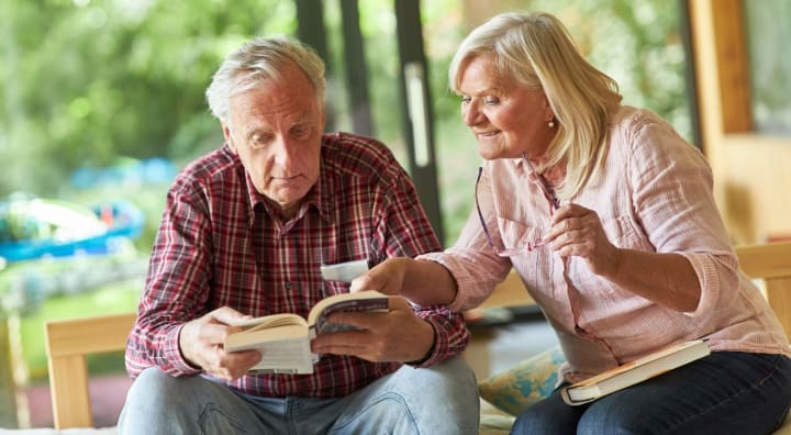 Senior couple reading a book together