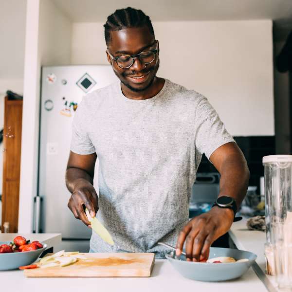 Resident cooking in kitchen at The Gallery On Wells in Chicago, Illinois