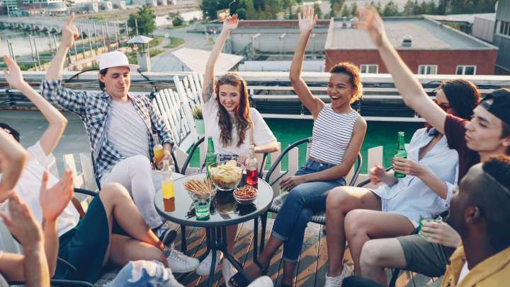 Group of friends enjoying rooftop and patio dining in the Cultural District 