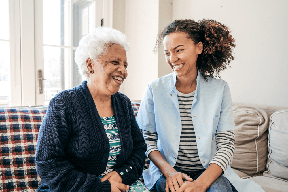 Resident talking with a health professional at The Manor at Market Square in Reading, Pennsylvania