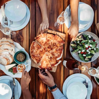 Residents and friends meeting up for pizza near Landmark Apartments Phase II in Little Rock, Arkansas