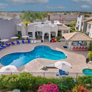 Aerial shot of the swimming pool and outdoor barbeque area at Cabrillo Apartments in Scottsdale, Arizona