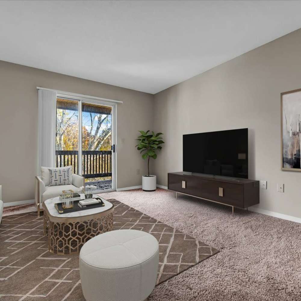 Modern living room with comfortable seating at Woodbrook in Gardendale, Alabama
