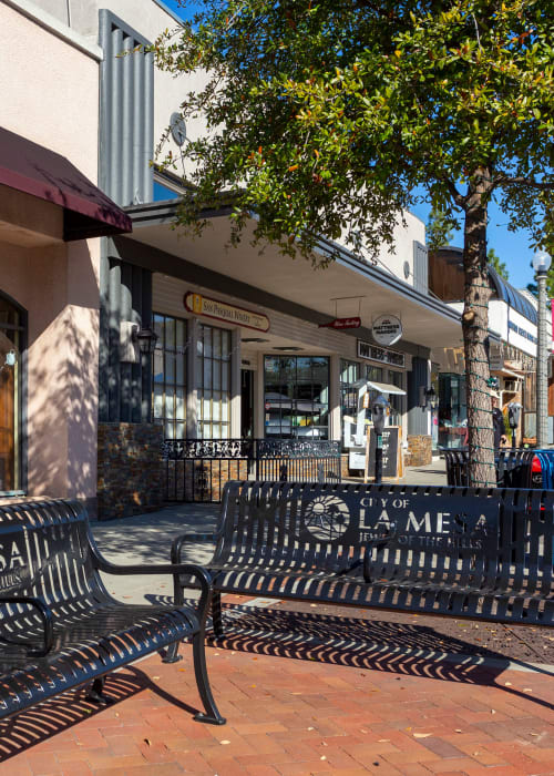 Public bench near sidewalk in La Mesa, California