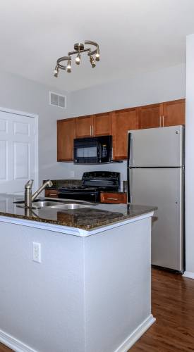Kitchen with appliances at One Belmar Place in Lakewood,Colorado