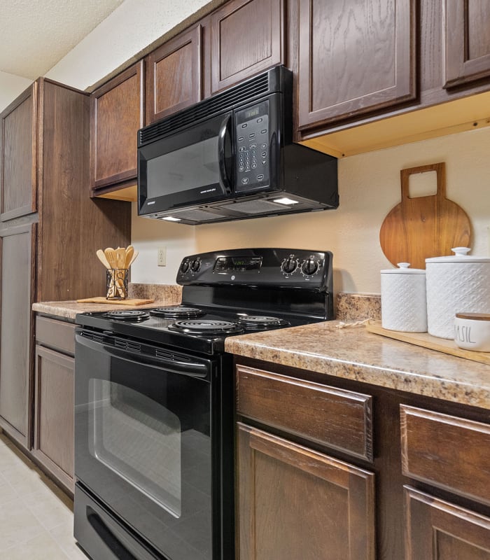 Kitchen with granite countertops at Sugarberry Apartments in Tulsa, Oklahoma