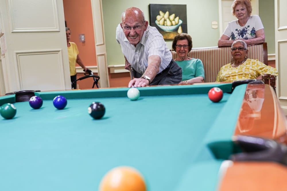 Residents playing pool together The Harmony Collection at Roanoke - Memory Care in Roanoke, Virginia