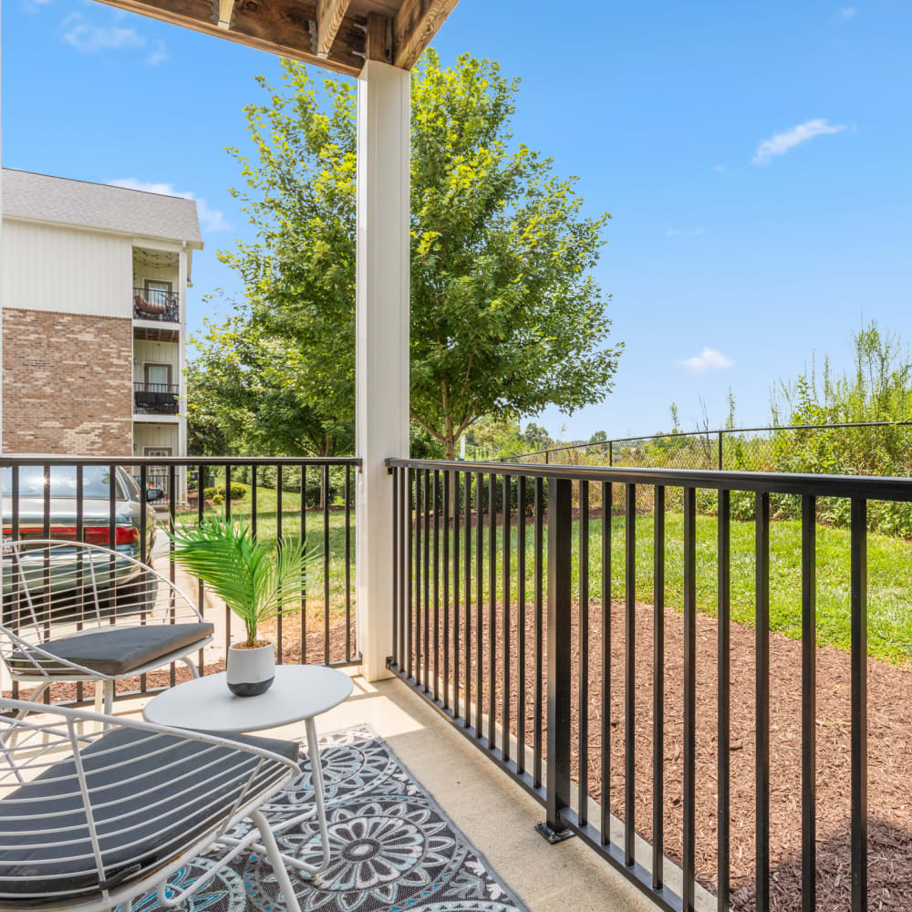 Secluded patio overlooking green grass  at Retreat at the Park in Burlington, North Carolina