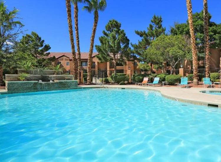 Resort-style swimming pool with a fountain and spa at Alterra Apartments in Las Vegas, Nevada