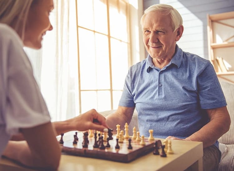 A resident partaking in a particularly exciting and competitive chess match at Creekside Village in Ponca City, Oklahoma.