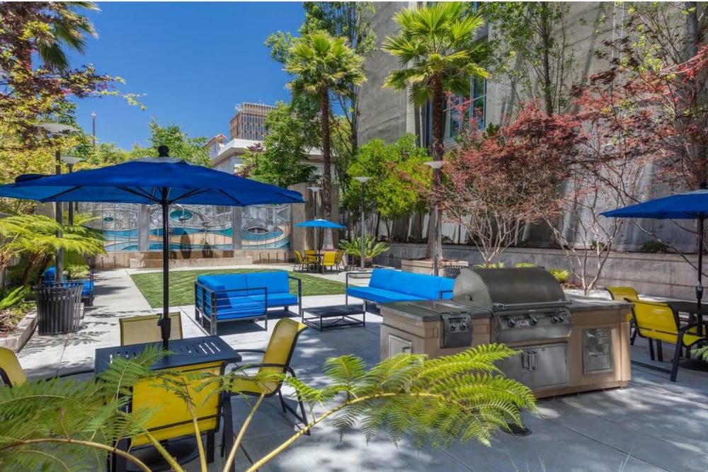 Outdoor courtyard seating with BBQ area at K Street Flats Apartment Homes in Berkeley, California