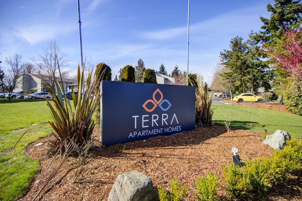 Monument sign welcoming current and future residents to their new apartmenth homes at Terra Apartment Homes in Federal Way, Washington