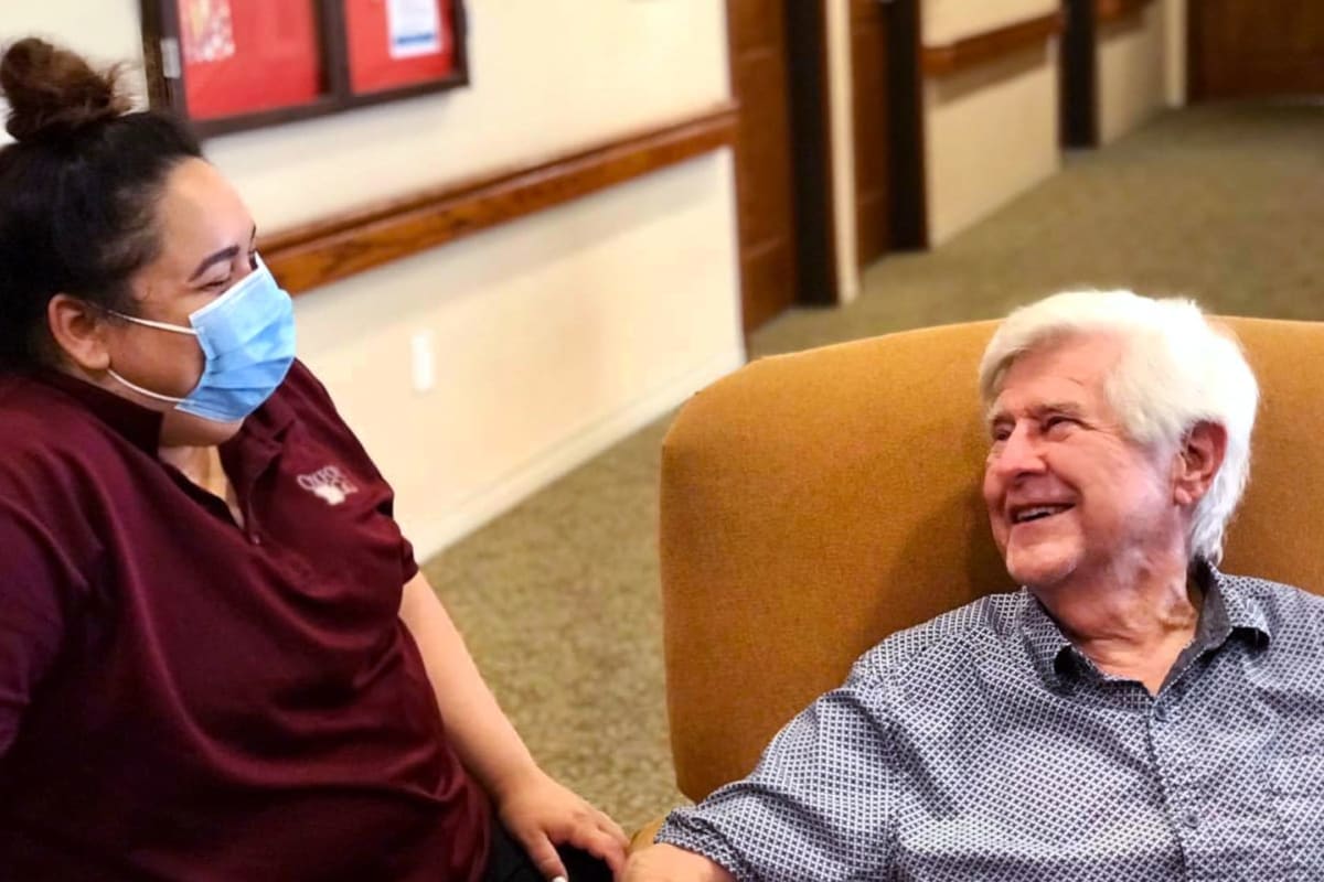 A resident and a caregiver having a nice conversation at FountainBrook in Midwest City, Oklahoma