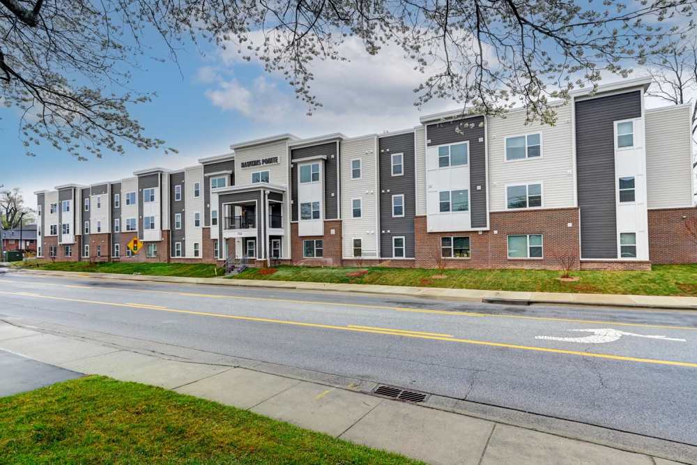 Modern apartment community with stylish exterior and landscaped grounds at Hawkins Pointe in Hendersonville, North Carolina