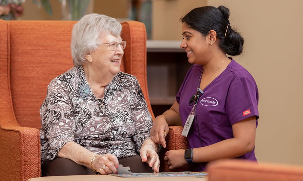 On call nurse assisting a resident.