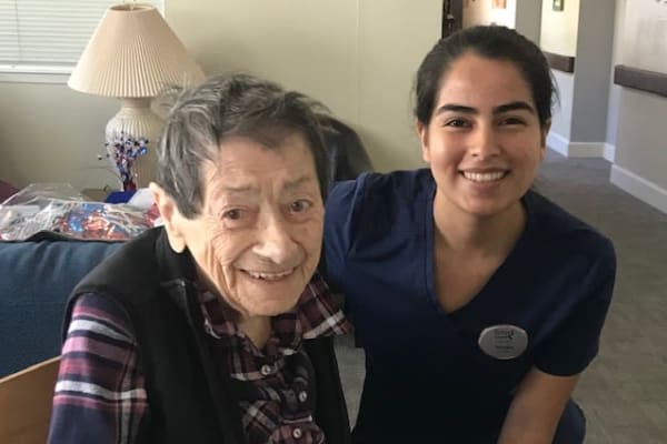 A caretaker with a senior at Peters Creek Retirement & Assisted Living in Redmond, Washington