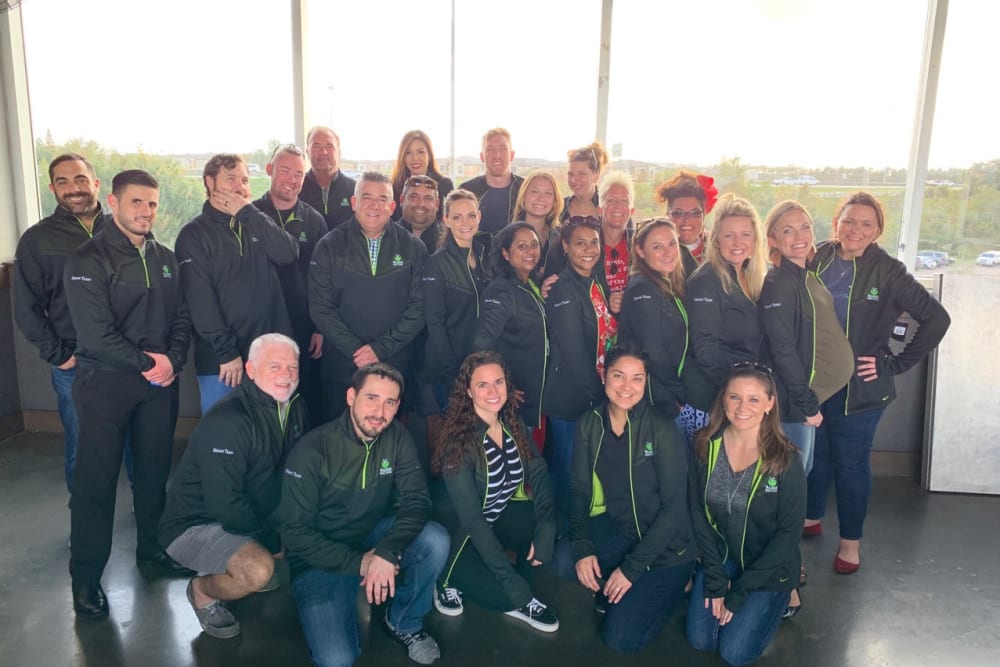 Group of staff in matching jackets at Inspired Living Sarasota in Sarasota, Florida.