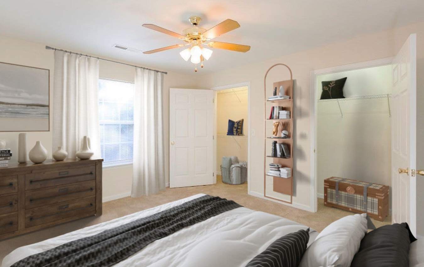 Bedroom with ceiling fan at Home Place Apartments in East Ridge, Tennessee