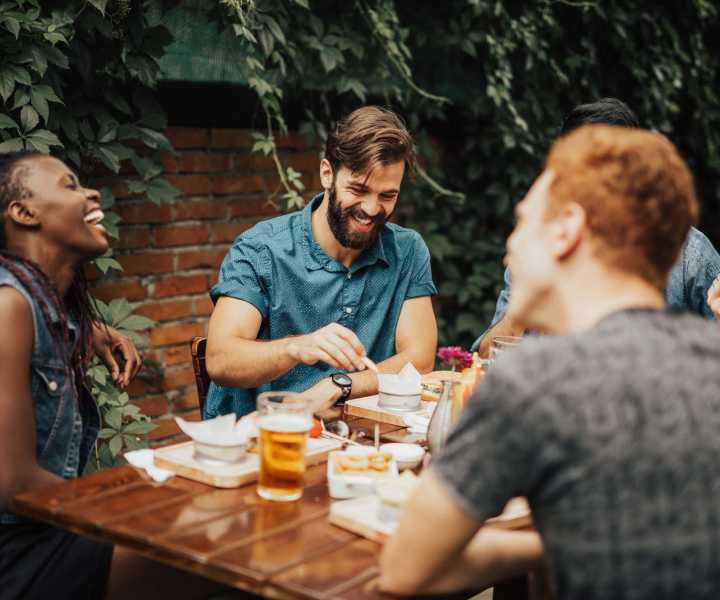 Residents enjoying food and drinks at a restaurant near Fox Hollow in Orlando, Florida