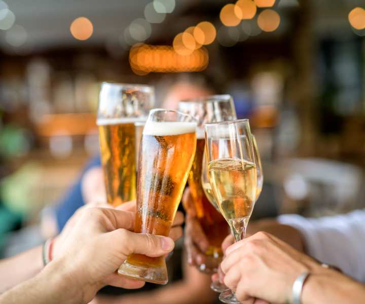 Resident enjoying a cocktail in bar near Country Brook Rental Condominiums in San Ramon, California