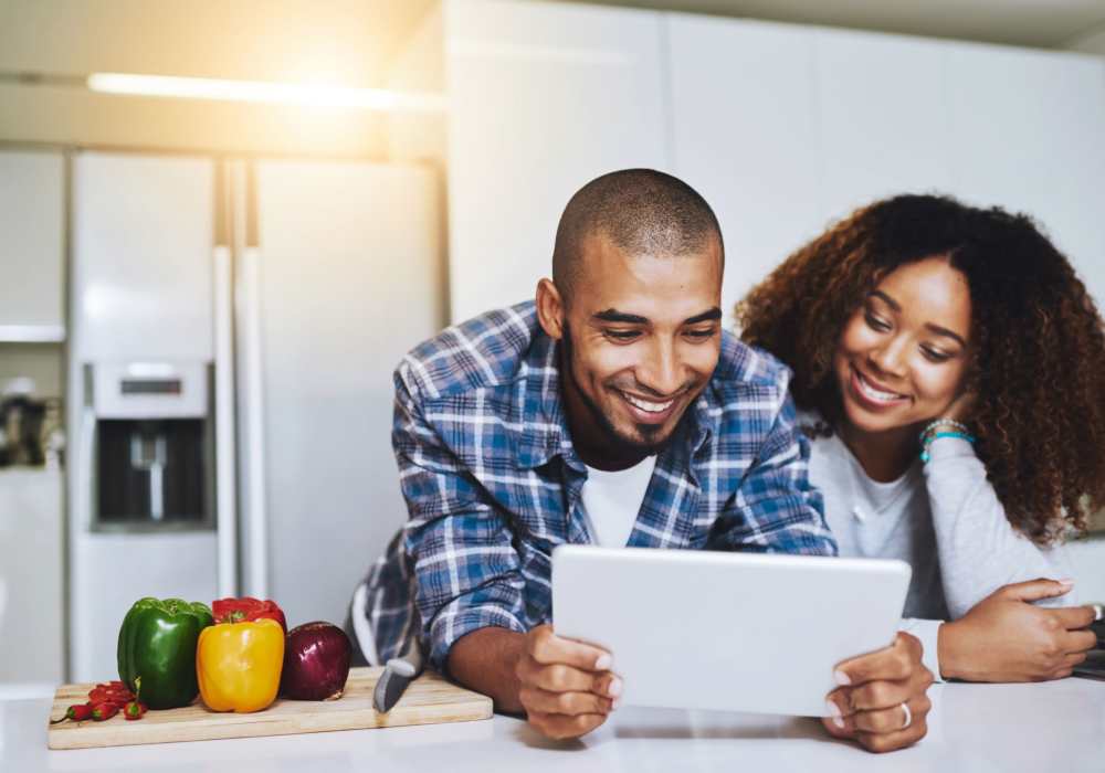 Resident couple relaxing in their new home at Hearthwood Apartments in Charlottesville, Virginia