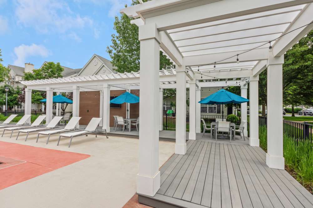 Seating area by the pool at Eagle Rock Apartments at Freehold in Freehold, New Jersey
