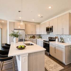 Kitchen with oversized island at Station A Apartments in Denver, Colorado