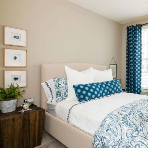 Fully furnished bedroom at The Heyward in Charleston, South Carolina